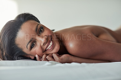 Buy stock photo Portrait of an attractive young woman lying on her bed