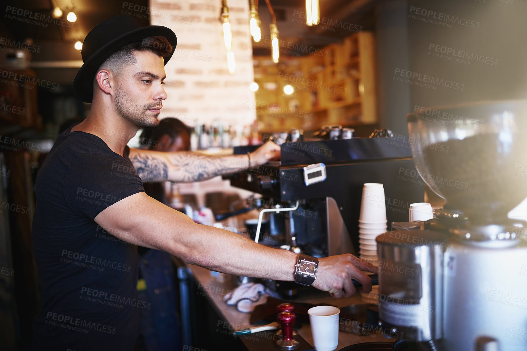 Buy stock photo Barista, coffee shop and man in cafe with machine for serving caffeine, warm drinks and beverage for small business. Restaurant, hospitality and waiter by counter for service, help and working