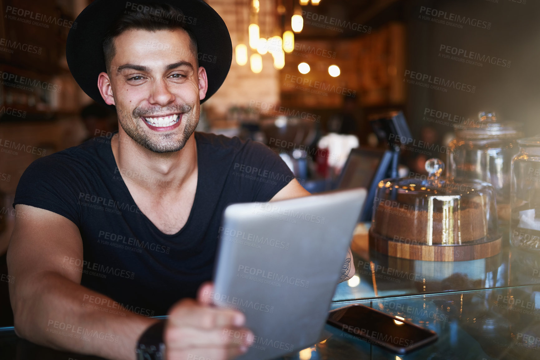 Buy stock photo Happy, coffee shop and man in cafe with tablet for small business, stock inventory and store website. Restaurant, hospitality and waiter by counter on digital tech for orders, help and inventory