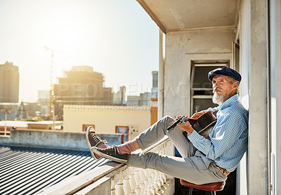 Buy stock photo Artist, senior and man with acoustic guitar for playing with retired musician on balcony in town for memories. Elderly, creative and proud of accomplishments with blues or folk song in urban Italy.