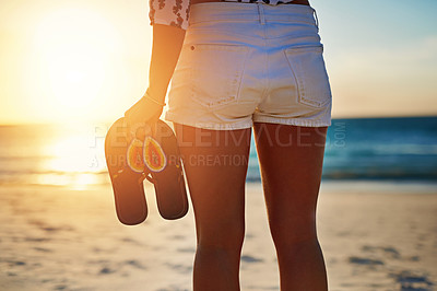 Buy stock photo Shot of an unecognizable woman on the beach