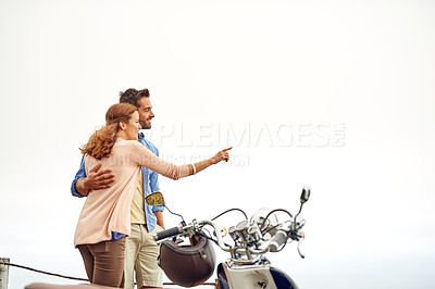 Buy stock photo Shot of an adventurous couple out for a ride on a motorbike