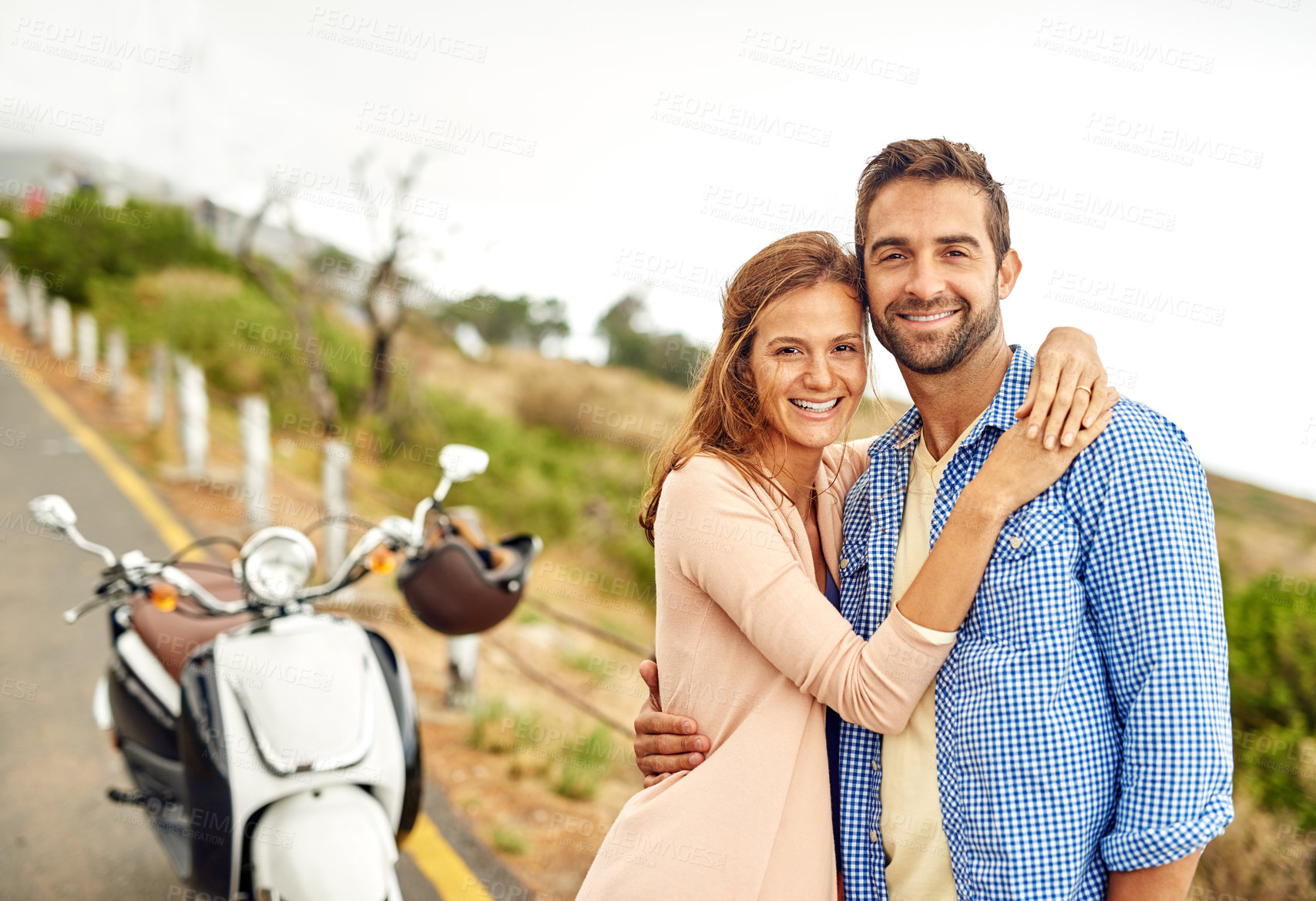 Buy stock photo Shot of an adventurous couple out for a ride on a motorbike