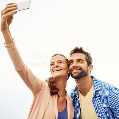 Buy stock photo Couple, phone and selfie on holiday, smile and outdoors on adventure, love and memories for social media. Happy people, smartphone and bonding or technology, travel and vacation or profile picture