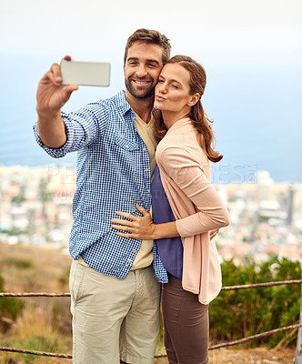 Buy stock photo Couple, hug and selfie on vacation, phone and outdoors on adventure, love and memories for social media. Happy people, smartphone and bonding or technology, travel and holiday or pout on date