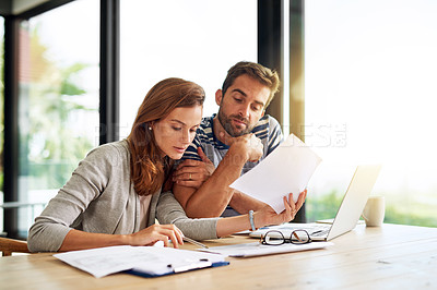 Buy stock photo Finance, documents and couple planning budget for tax, bills and savings on laptop with banking, online payment and investment. People, paperwork and conversation on household financial strategy