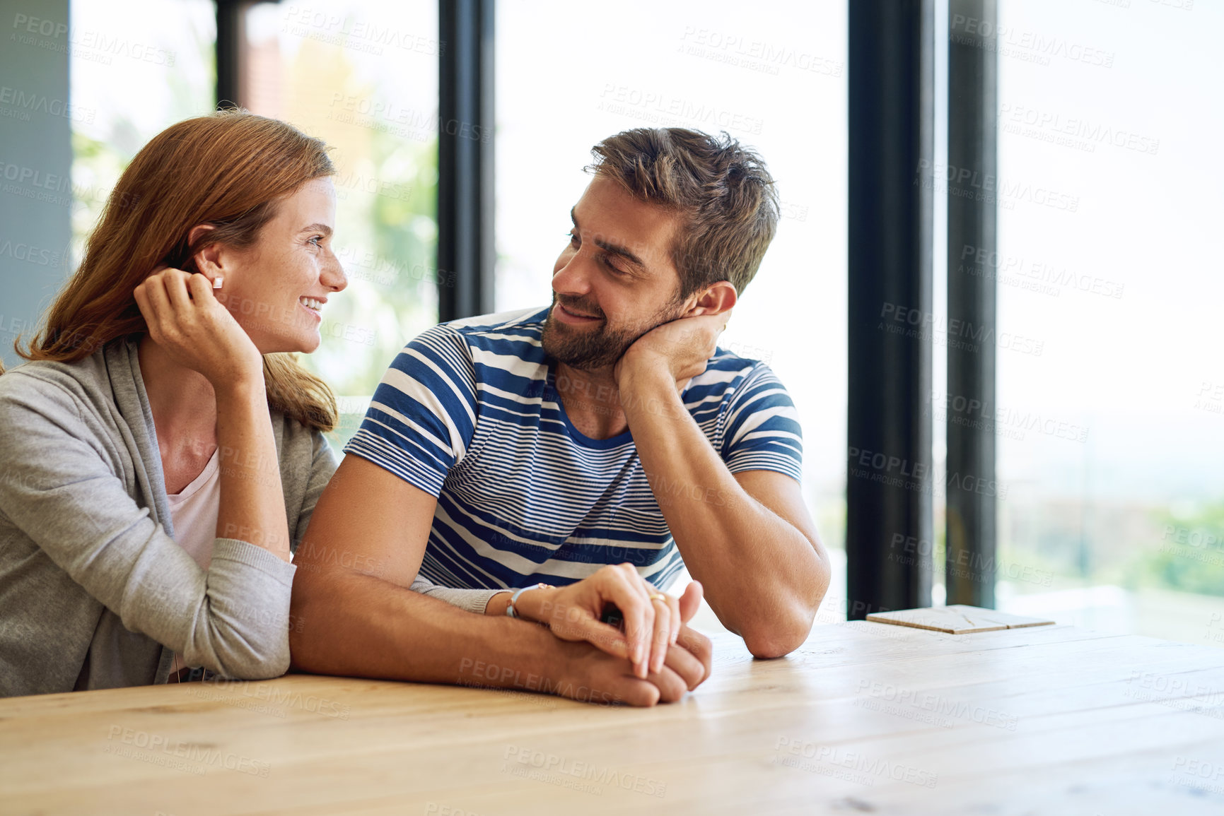 Buy stock photo Cropped shot of an affectionate young couple spending the weekend at home