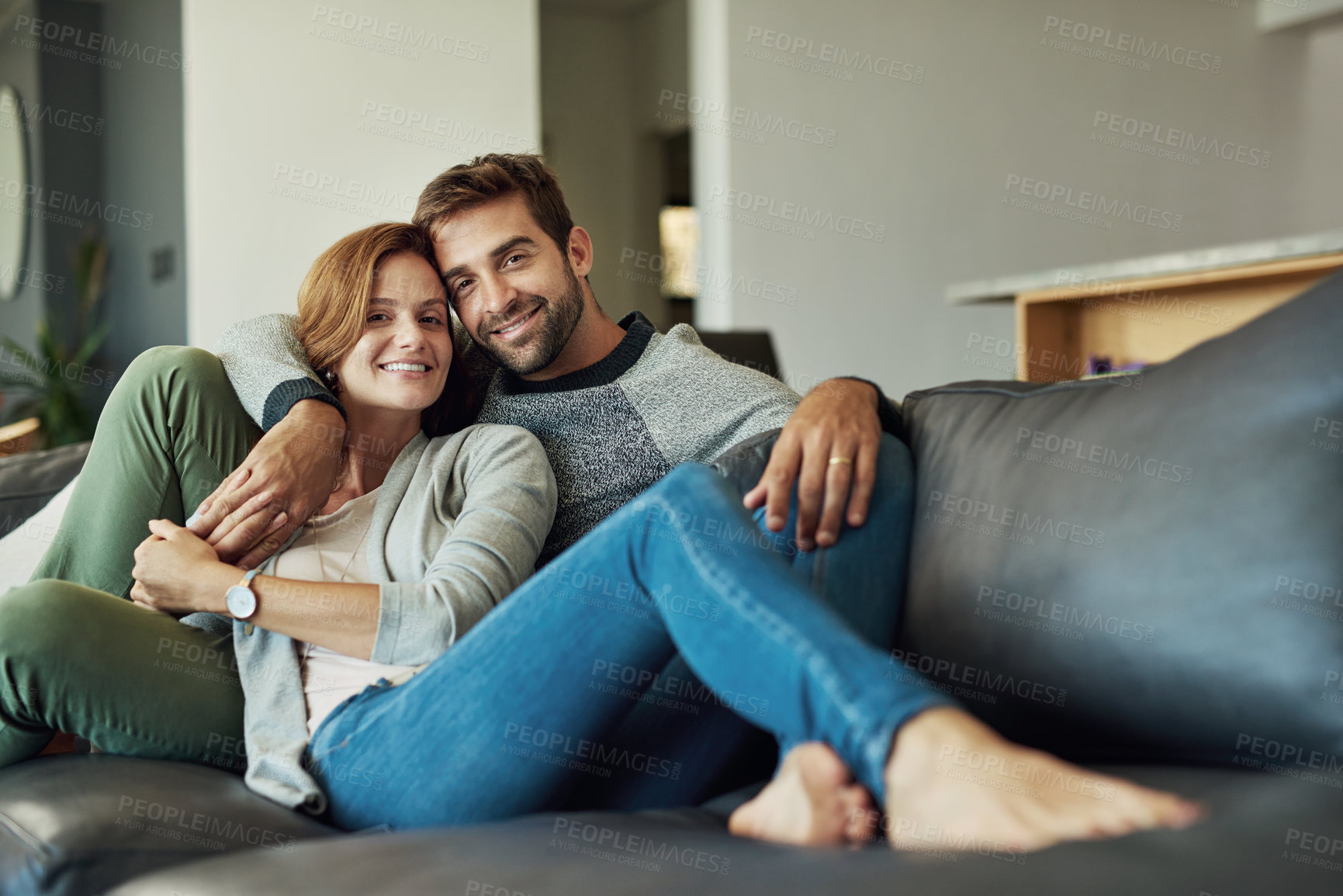Buy stock photo Couple, portrait and relax on sofa at house for comfort, love and bonding time together with trust and care. Man, woman and happy in living room for connection, peace or support on weekend with smile