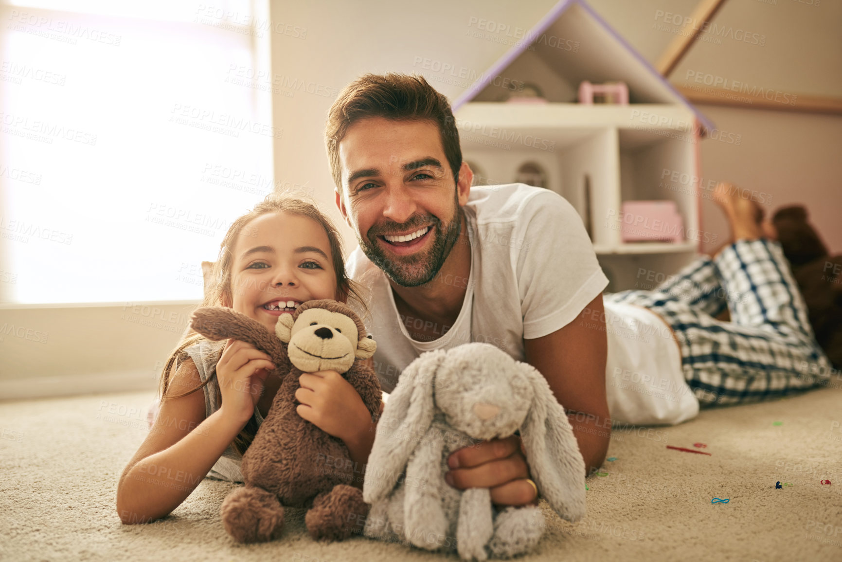 Buy stock photo Portrait of a handsome young man and his daughter playing with stuffed toys on her bedroom floor