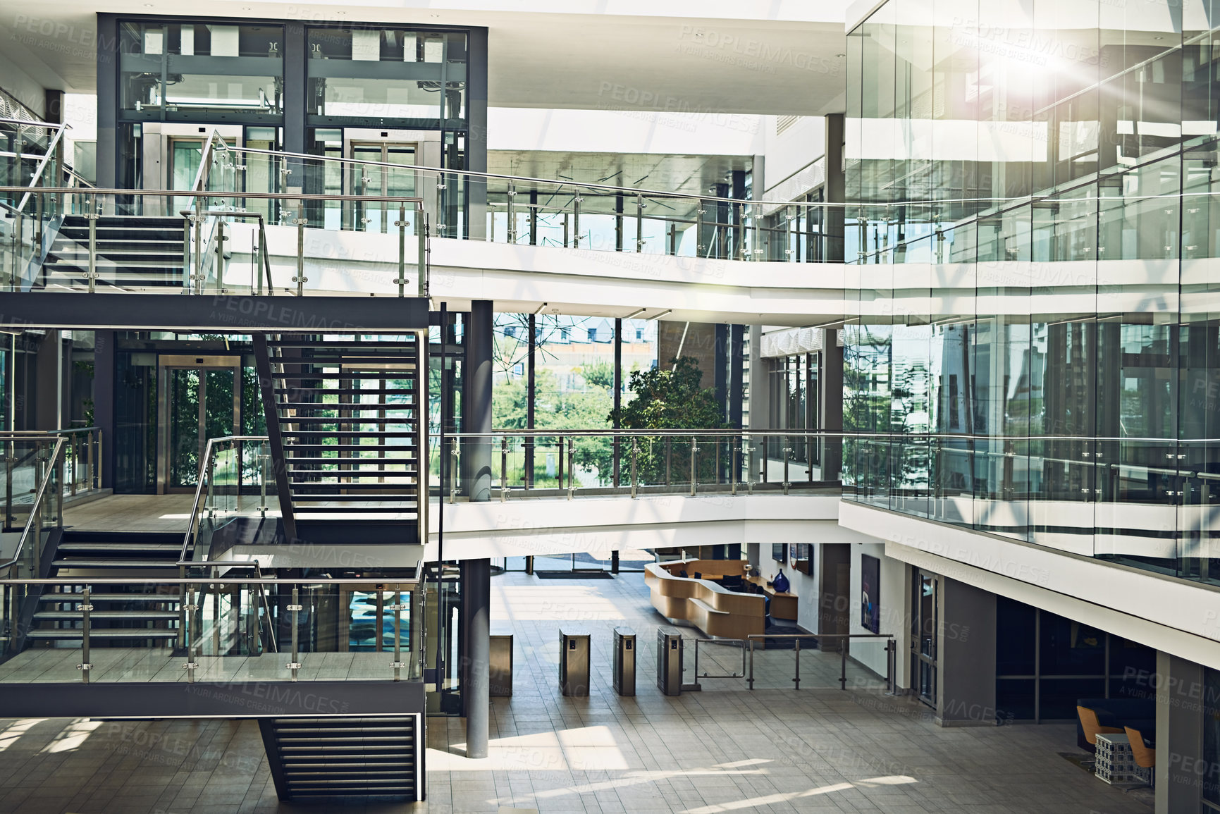 Buy stock photo Shot of an empty three story building from the inside covered in glass windows