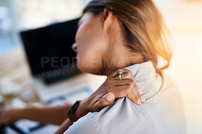 Buy stock photo Cropped shot of a businesswoman experiencing body discomfort in the office