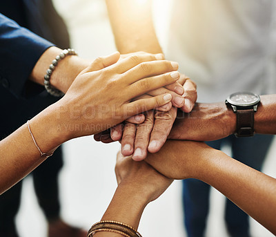 Buy stock photo Business people hands stacked together showing unity, teamwork and collaboration in a multicultural or diverse business team. Group of corporate workers joining, working together and standing united