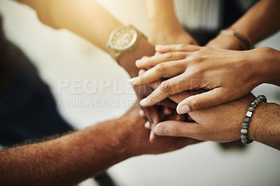 Buy stock photo Closeup shot of a group of unrecognizable businesspeople joining their hands together in a huddle