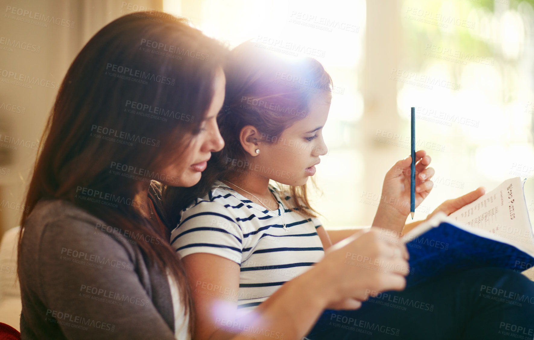 Buy stock photo Shot of a happy young mother and daughter enjoying their time together