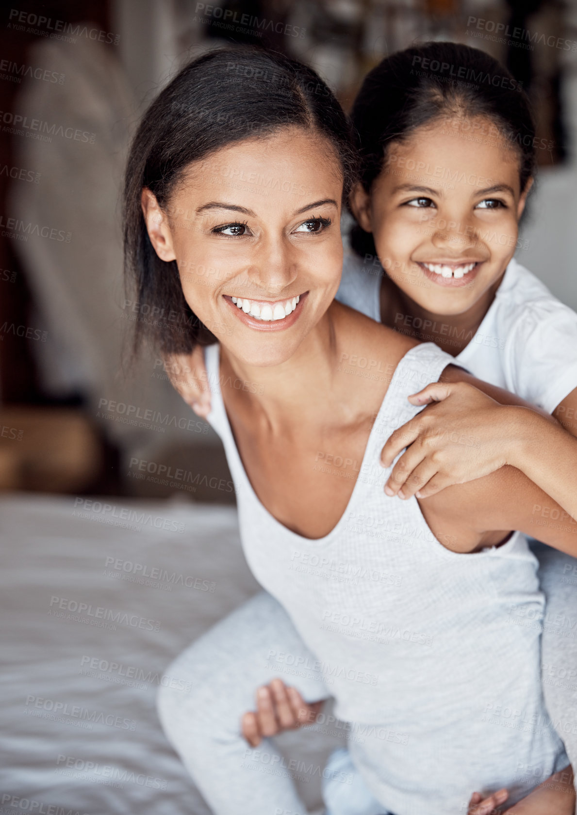 Buy stock photo Shot of a mother and her little daughter bonding together at home