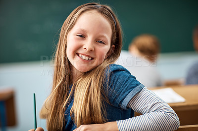 Buy stock photo Portrait of an elementary school girl sitting in class
