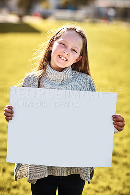 Buy stock photo Portrait of a little girl holding a blank board outdoors