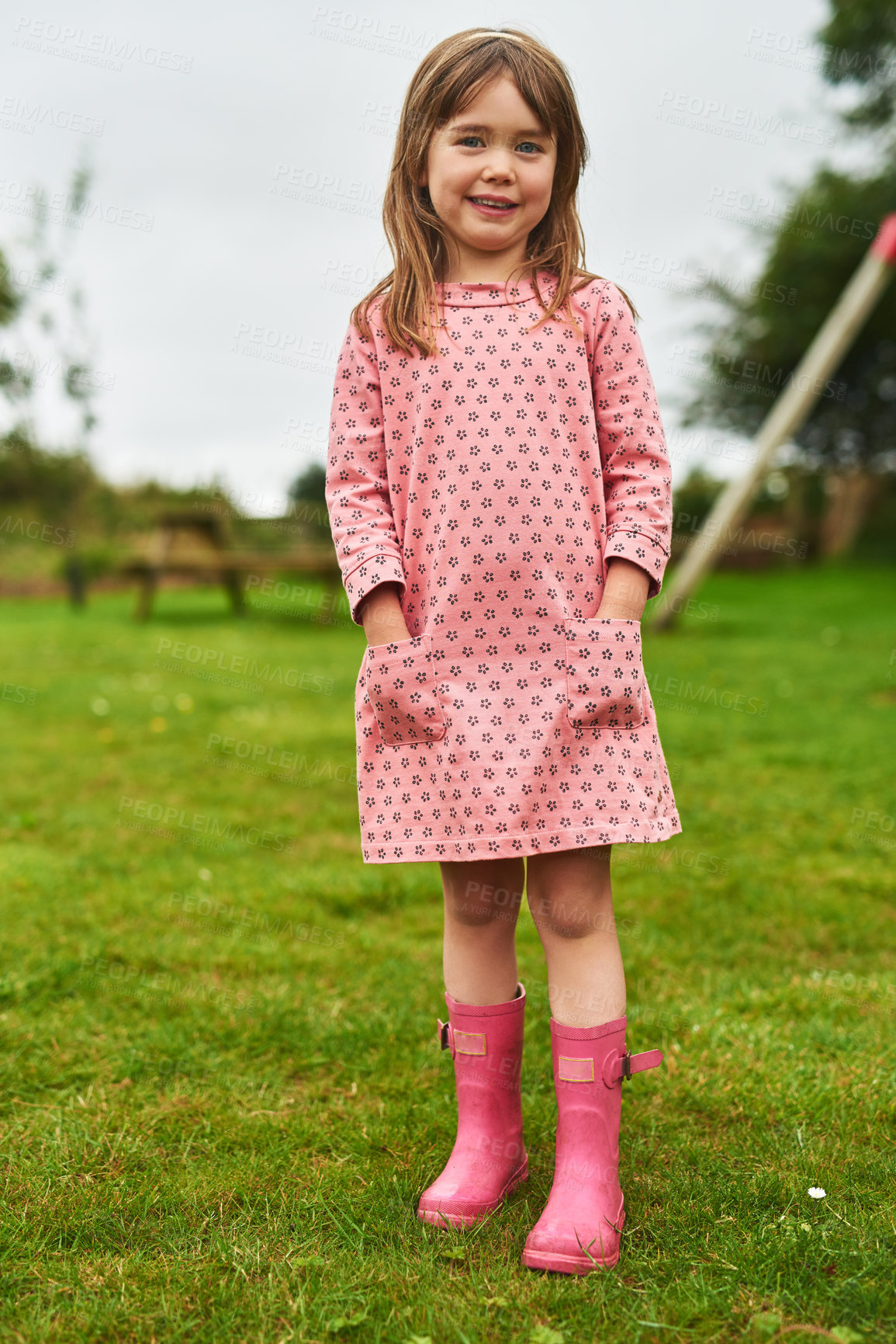 Buy stock photo Portrait of an adorable little girl having fun outdoors