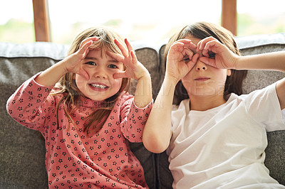 Buy stock photo Portrait, siblings and sisters on a couch, funny and facial expression with happiness, bonding and loving. Face, female children or young people with joy, silly and goofy with a smile, home and relax