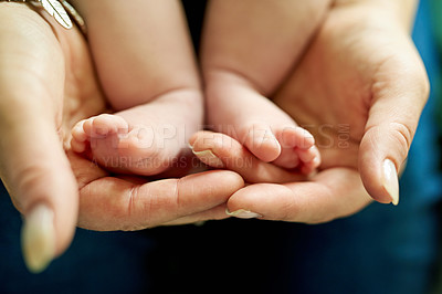 Buy stock photo Baby feet, hands of mother and love in home for care, family and security of newborn. Closeup, mom and infant toes on palms for trust, support and relationship development in motherhood in maternity