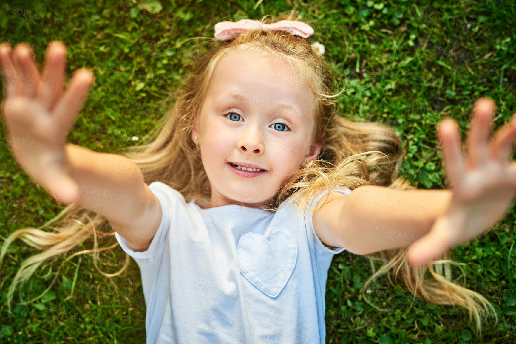 Buy stock photo Child, girl and portrait with selfie outdoor on lawn for happy memory, profile picture and relax in garden. Kid, face and smile in home with confidence, holiday fun and resting on grass in New York