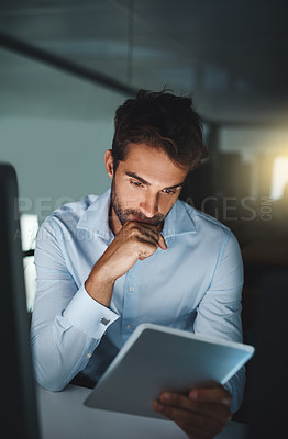 Buy stock photo Businessman, night and thinking with tablet at office for research or reading online news. Young man, journalist or employee working late in decision or choice with technology for agenda at workplace