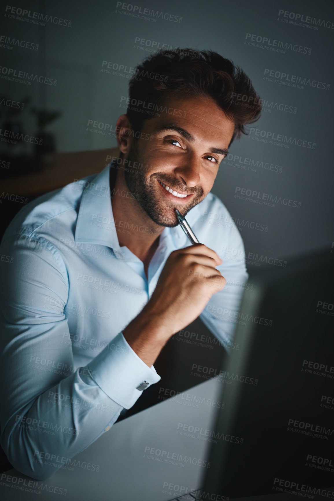 Buy stock photo Smile, portrait and businessman with pen by computer for email, internet and working late in office for corporate career. Happiness, desk and lawyer with technology for communication in workspace