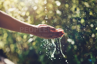 Buy stock photo Closeup shot of a man holding his hands under a stream of water outdoors