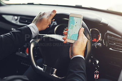 Buy stock photo Closeup shot of an unrecognizable businessman using his cellphone while driving