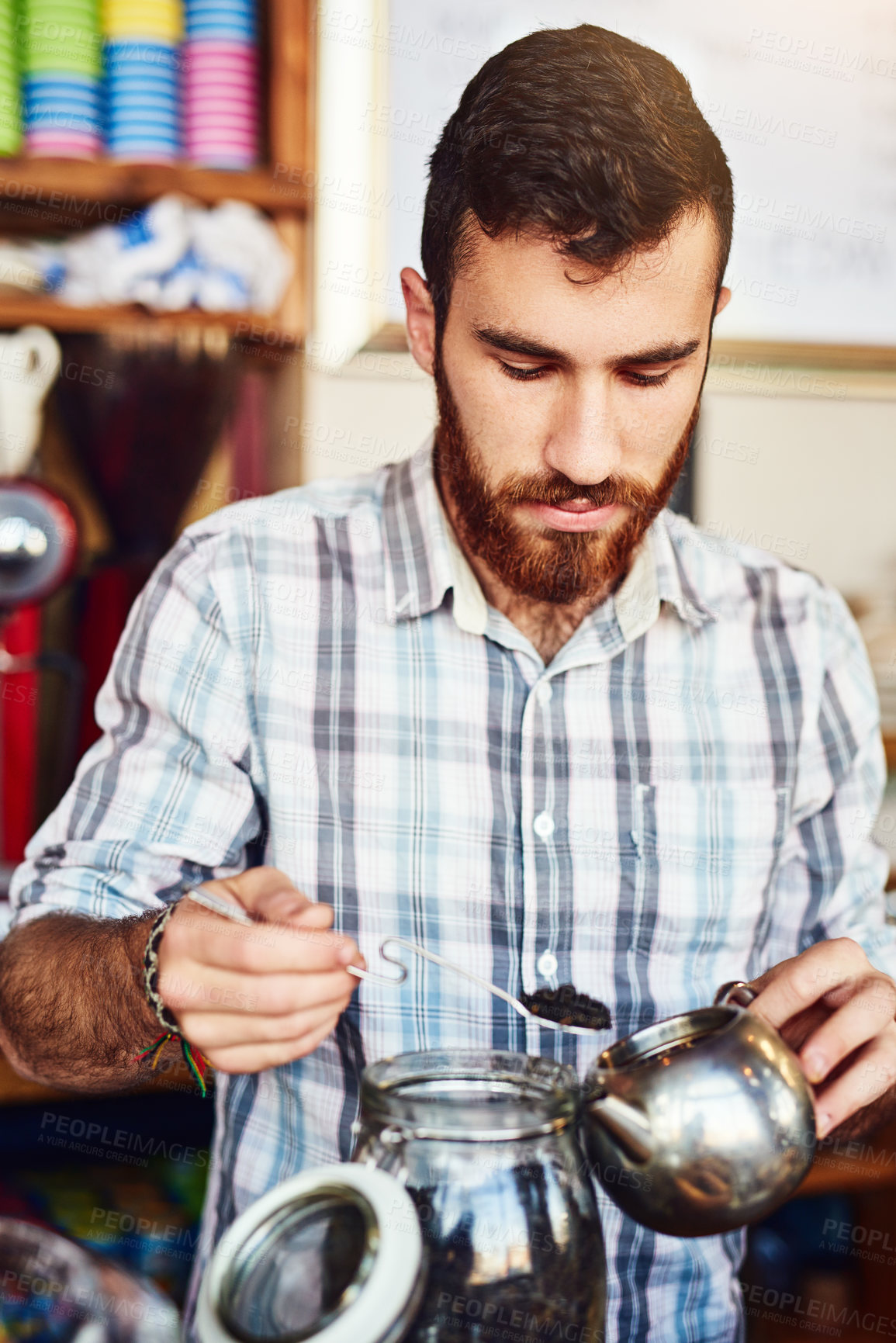 Buy stock photo Tea, leaves and man in cafe with pot for natural drink, wellness and calm process at small business. Relax, hospitality and person in restaurant with healthy herbal brew in teapot for morning service