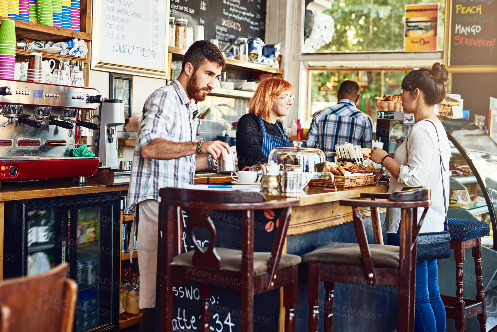 Buy stock photo Women, cashier and talk to customer in coffee shop for catering for breakfast, drink and snack in morning. People, waitress and barista at cafeteria for choice, service or dessert at small business