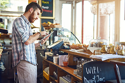 Buy stock photo Tablet, cafe owner and man doing inventory while working on a startup business plan in a restaurant. Technology, entrepreneur and male barista doing research on a digital mobile in his coffee shop.