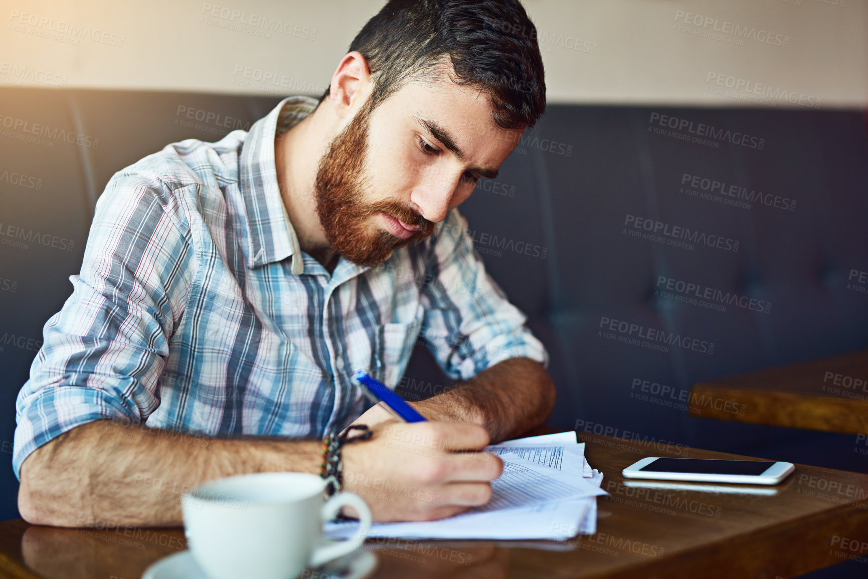 Buy stock photo Coffee shop, writing and man with documents for stock inventory, menu items and checklist. Restaurant waiter, small business and person with paperwork for planning, budget review and cafe products