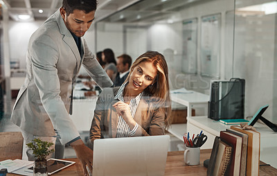 Buy stock photo Cropped shot of a young businessman helping an older female colleague in the office