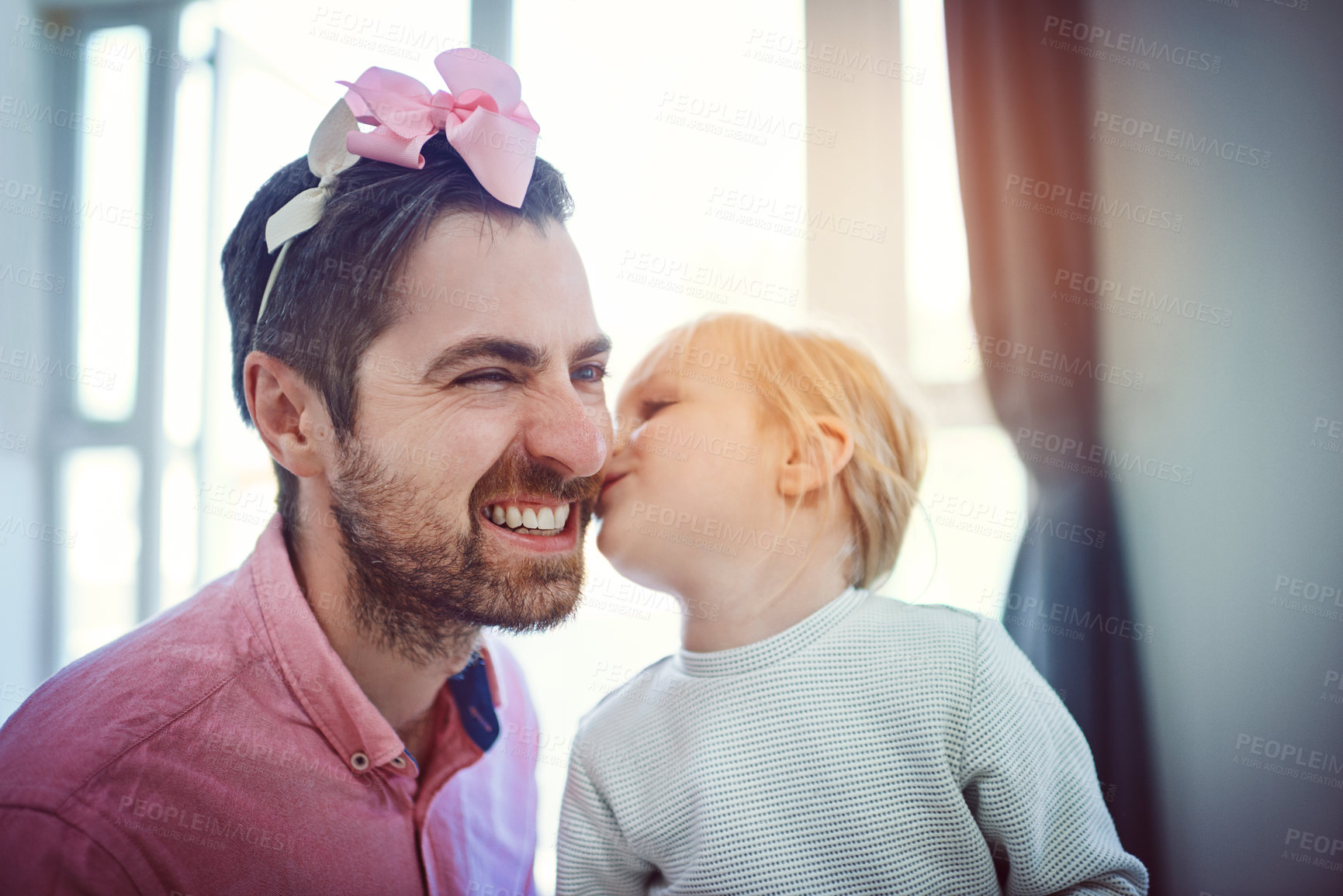 Buy stock photo Happy father, daughter and cheek with kiss for love, childhood or parent bonding with child at home. Dad, little girl or kid with smile for embrace, affection or support for family time at house