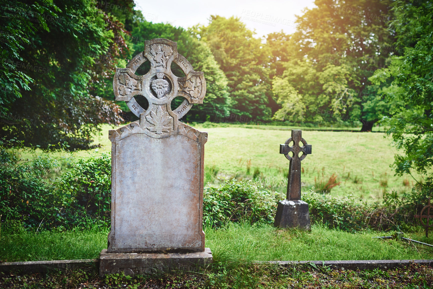 Buy stock photo Celtic cross, tombstone and cemetery for memory, peace and empty outdoor. Christian crucifix, old gravestone and graveyard for catholic history, death and holy site for remembrance in Ireland