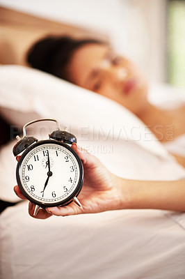 Buy stock photo Woman, alarm and hand in bedroom, clock and tired or lazy in morning with noise alert in home. Hotel, ring and wake up time after sleep or snooze, rest and relax for burnout, apartment or hospitality