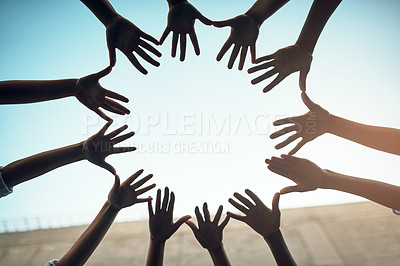 Buy stock photo Teamwork, circle and blue sky with hands of people for support, community and help with bottom view. Collaboration, trust and motivation with closeup of friends for  partnership, solidarity and faith