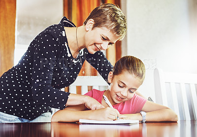 Buy stock photo Happy mother, child and writing in home school for education, studying or math lesson of family together. Smile, mom and help kid learning, homework and teaching student on notebook for development