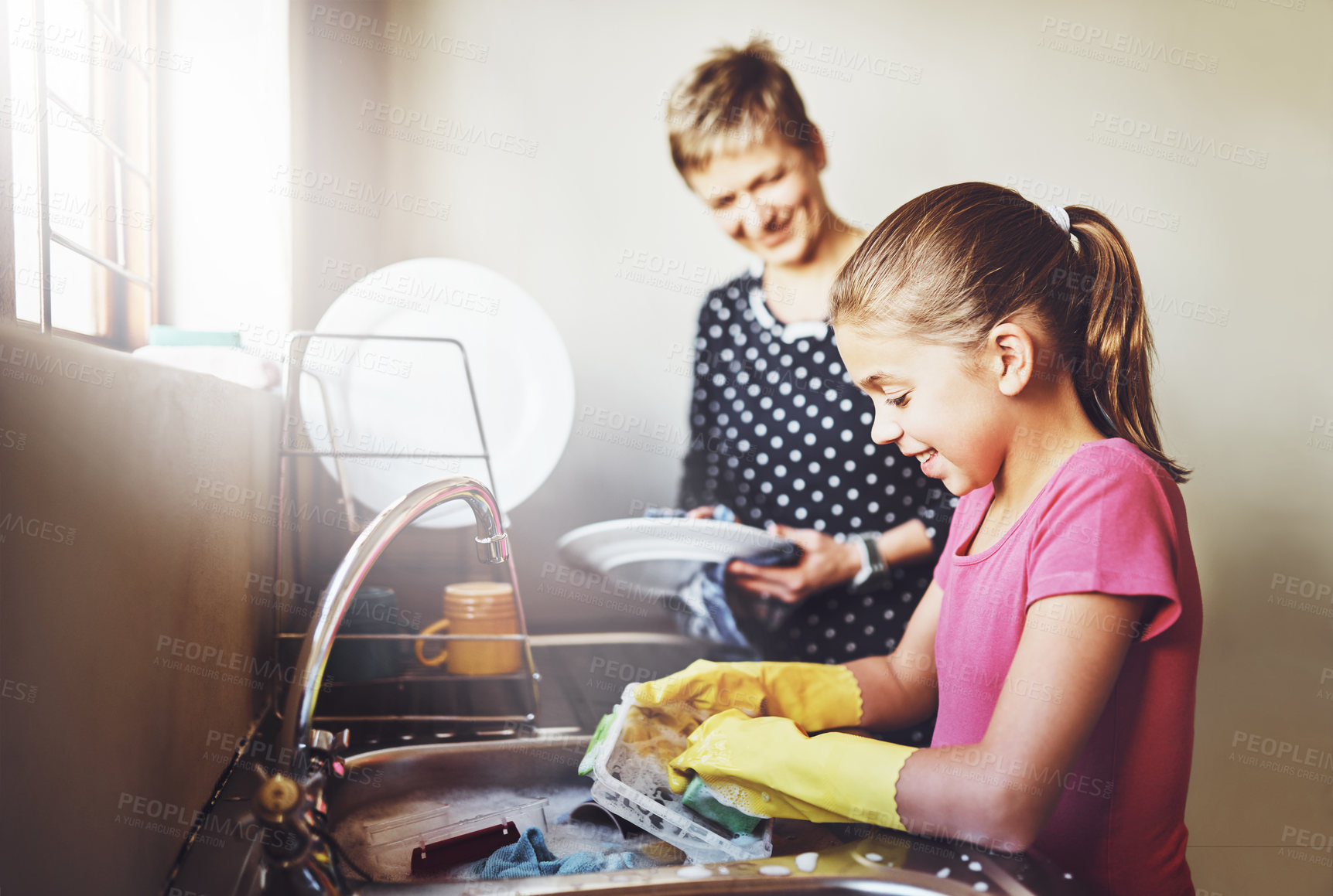 Buy stock photo Kitchen, mother and daughter washing dishes together with help, learning or teaching at basin. Housework, mom and girl in home cleaning at sink with smile, support and morning housekeeping chores