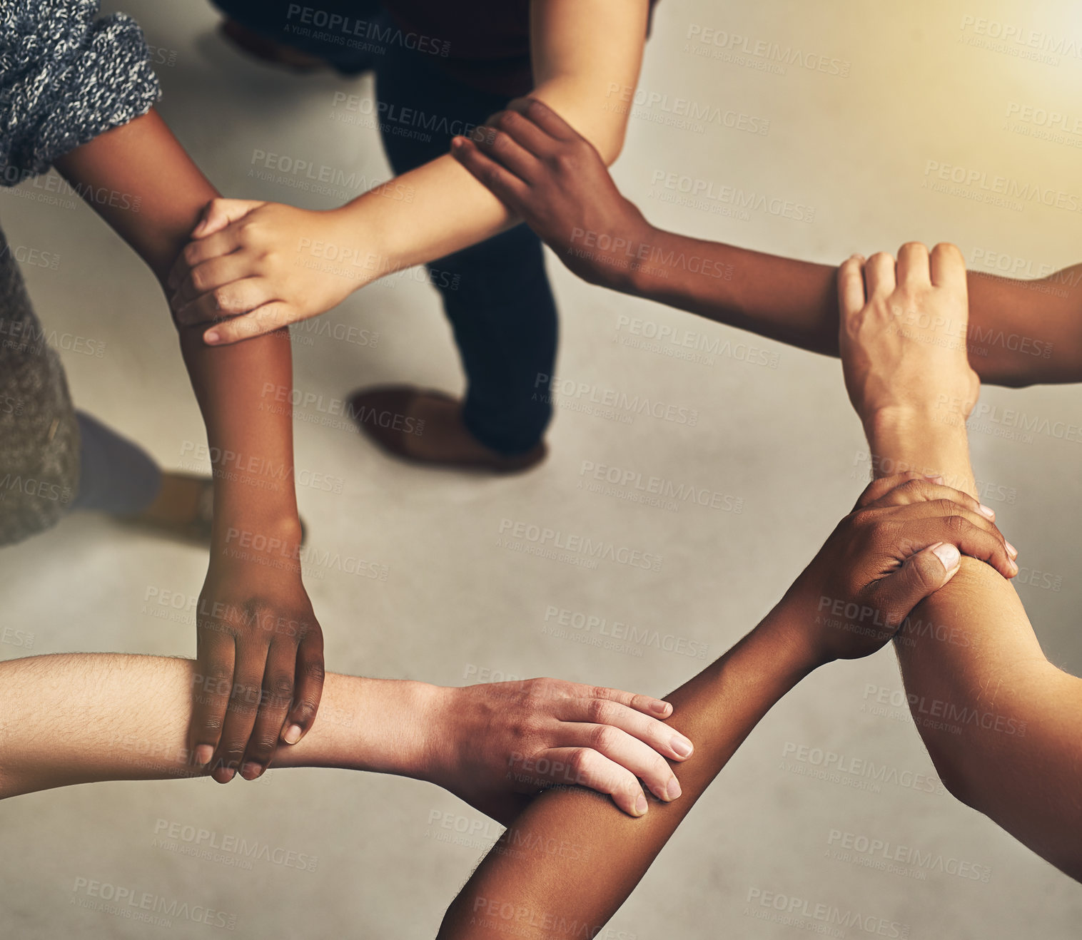 Buy stock photo Collaboration, arms in a circle and business people in the office from above for support or community. Teamwork, trust and solidarity with an employee group or team standing together in a huddle