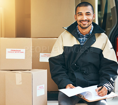 Buy stock photo Portrait of a courier checking the deliveries in his van