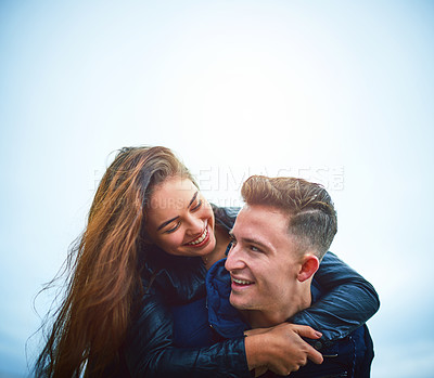 Buy stock photo Couple, hug and outdoor with smile, love and piggy back on date with bonding and mockup. Happy, romance and gen z people together with travel and holiday in winter with support and care with fun