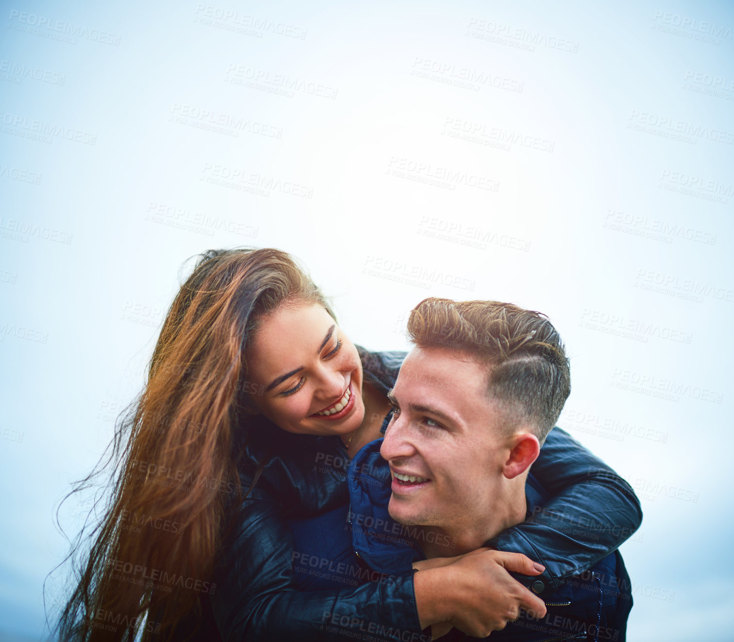 Buy stock photo Couple, hug and outdoor with smile, love and piggy back on date with bonding and mockup. Happy, romance and gen z people together with travel and holiday in winter with support and care with fun