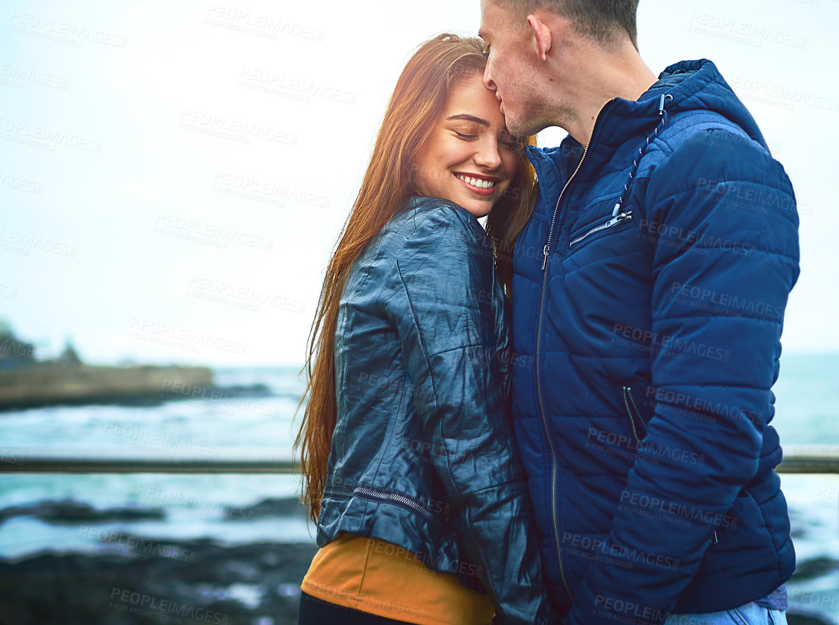 Buy stock photo Couple, kiss and beach for love, bonding and relax with relationship, romance and outdoor date. Man, woman and happy by ocean for care, support and connection with partner, smile and weekend together