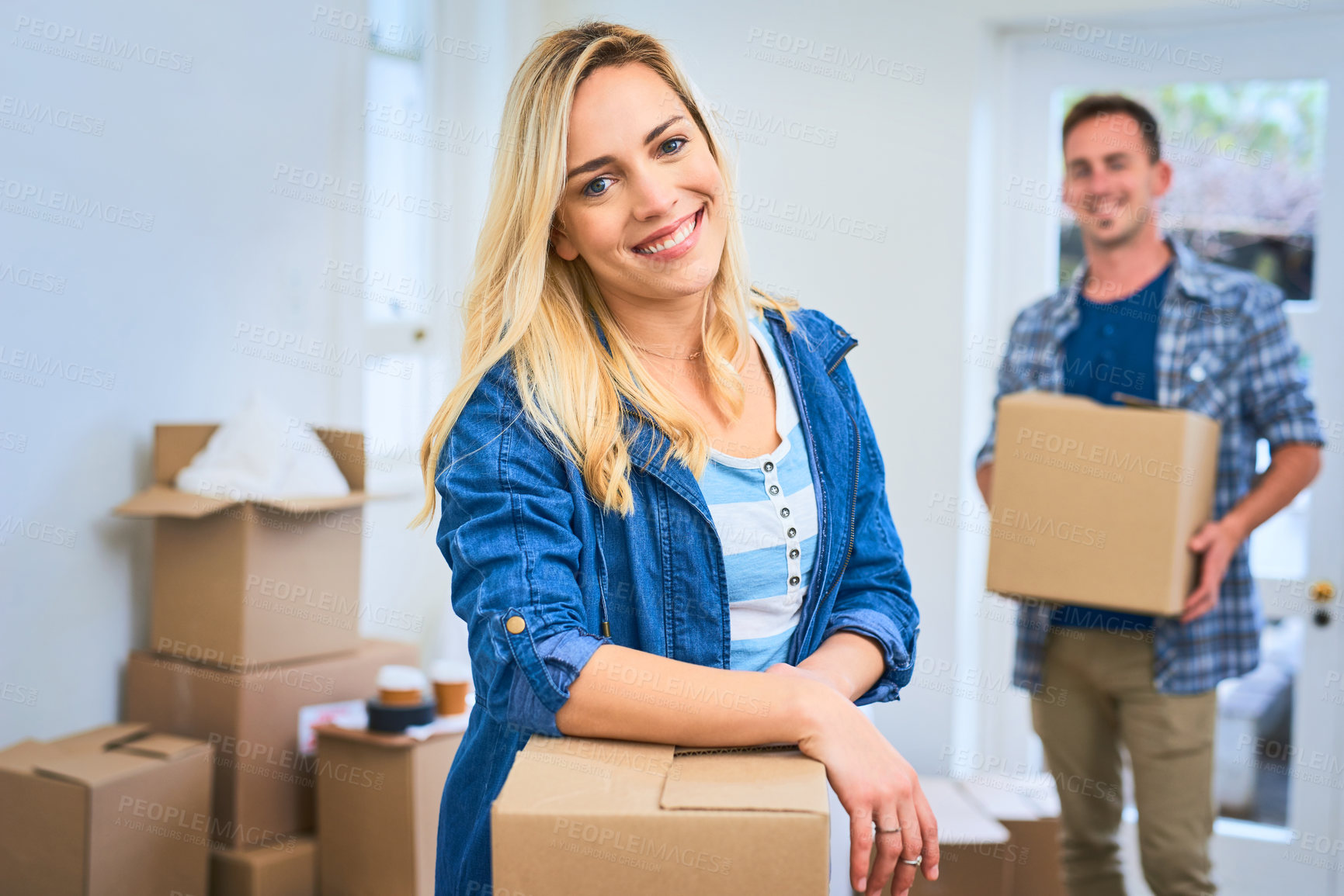 Buy stock photo Portrait of a young couple moving house