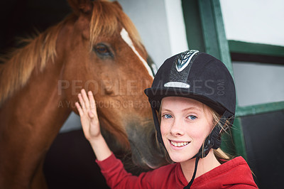 Buy stock photo Shot of a teenage girl bonding with her horse