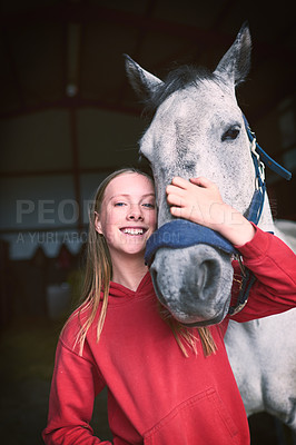 Buy stock photo Shot of a teenage girl bonding with her horse