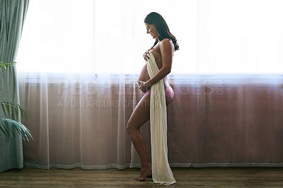 Buy stock photo Full length shot of an attractive young pregnant woman standing in her bedroom at home