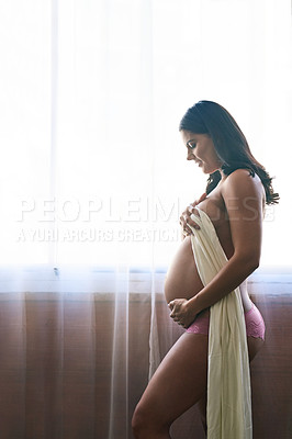 Buy stock photo Cropped shot of an attractive young pregnant woman standing in her bedroom at home